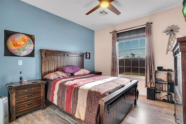 bedroom featuring ceiling fan and wood-type flooring