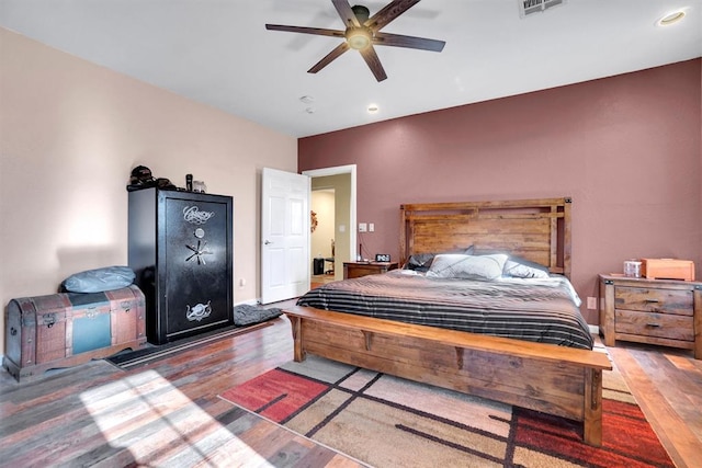 bedroom featuring wood-type flooring and ceiling fan