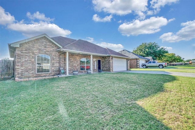 ranch-style home with a garage and a front yard