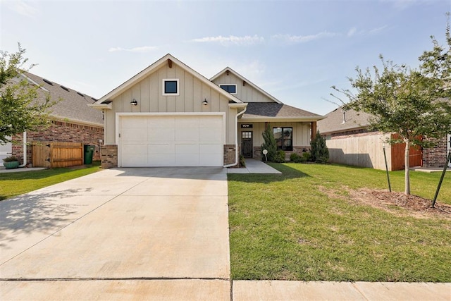 view of front of property featuring a front lawn and a garage