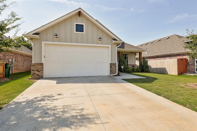 view of front facade with a front yard and a garage