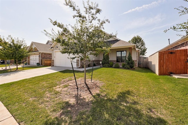 view of front of home featuring a front lawn and a garage