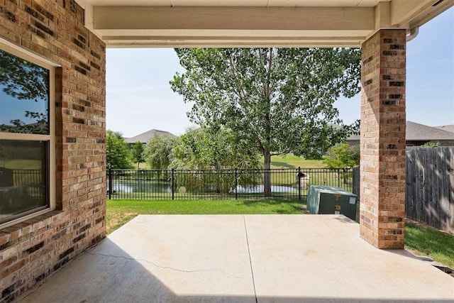 view of patio featuring a water view