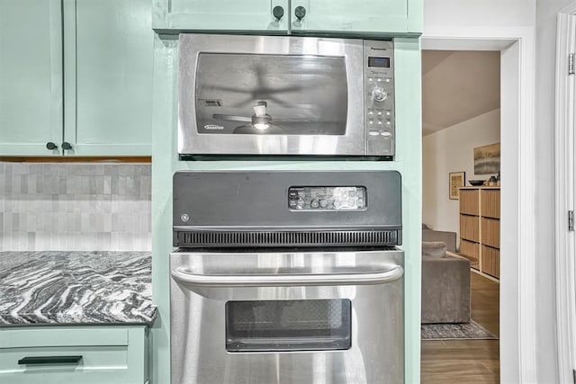 kitchen featuring appliances with stainless steel finishes and green cabinetry