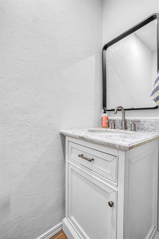 bathroom featuring hardwood / wood-style floors and vanity