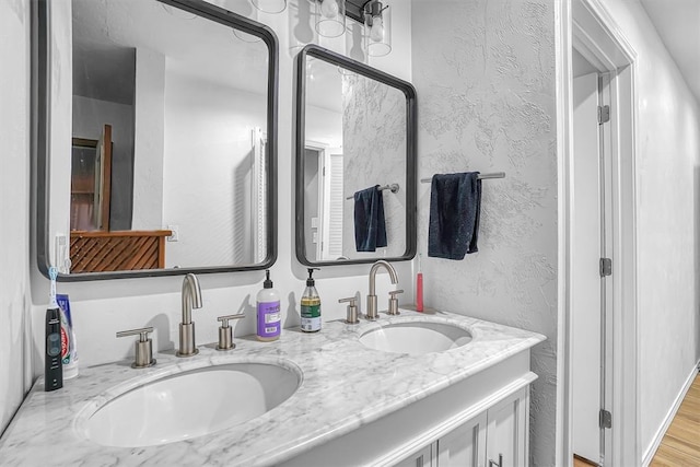 bathroom featuring wood-type flooring and vanity