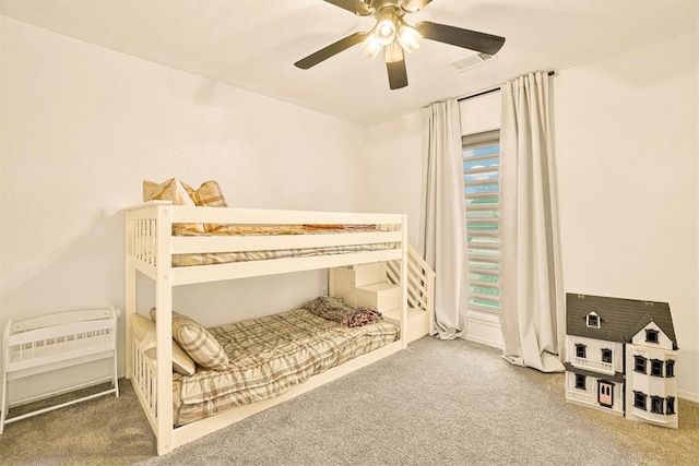 bedroom with ceiling fan and carpet