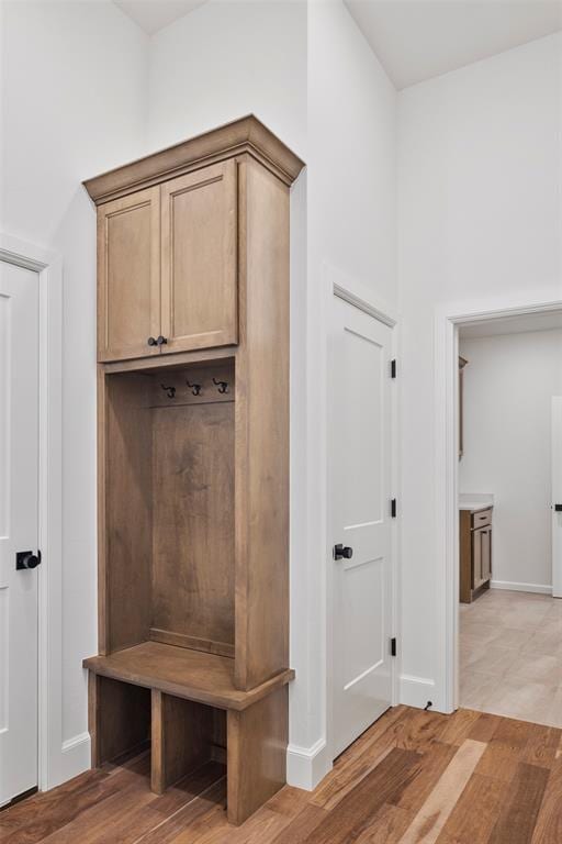 mudroom with light hardwood / wood-style flooring