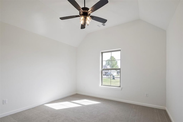 carpeted empty room with ceiling fan and vaulted ceiling