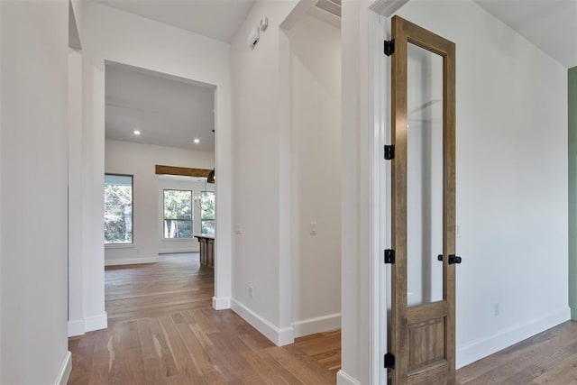 hall featuring french doors and light hardwood / wood-style floors