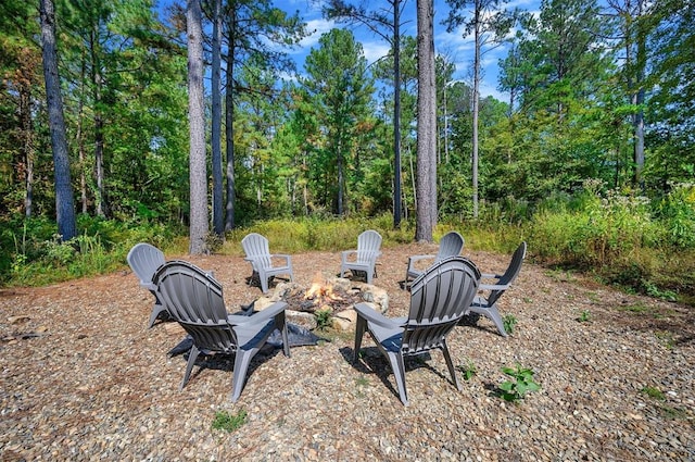 view of yard with a fire pit