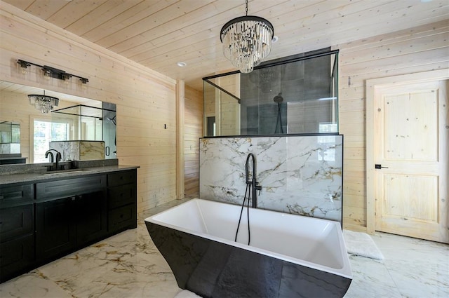 bathroom featuring a bath, wood walls, and a chandelier