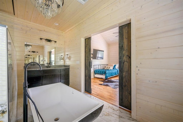 bathroom featuring hardwood / wood-style floors, wood walls, wood ceiling, and a bath