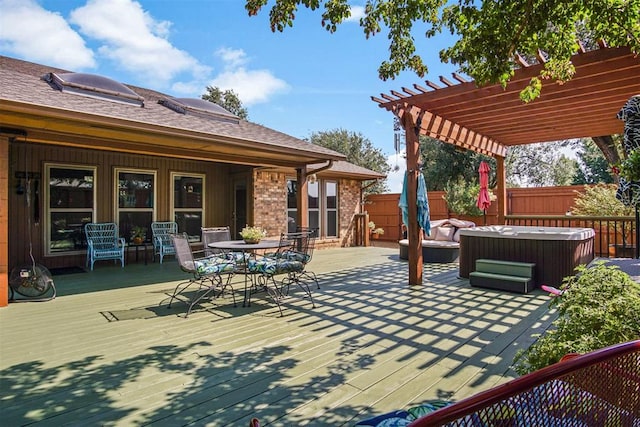 view of patio / terrace with a pergola, a wooden deck, and a hot tub