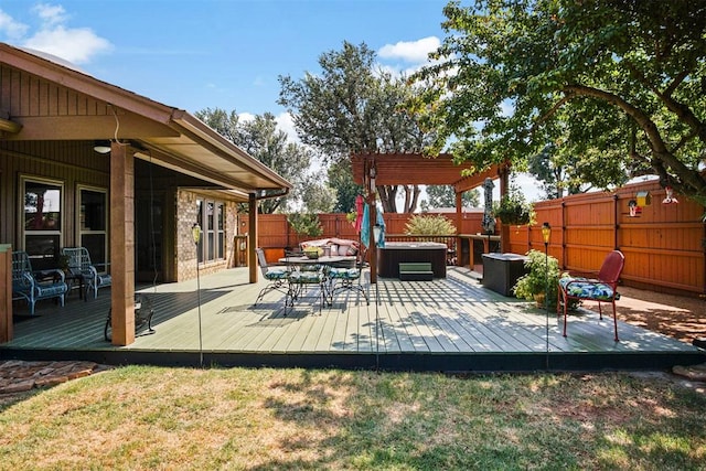 wooden terrace with a pergola and a hot tub