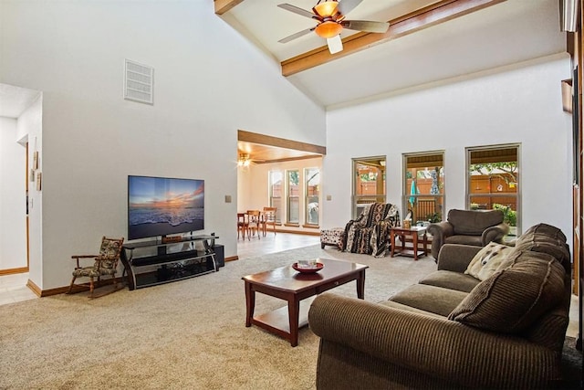 living room with beamed ceiling, ceiling fan, light carpet, and high vaulted ceiling