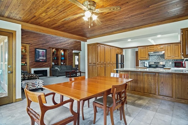 dining room featuring sink, ceiling fan, light tile patterned floors, beamed ceiling, and wood ceiling