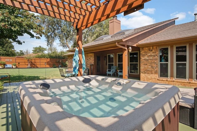 view of patio / terrace with a pergola, a deck, and a hot tub