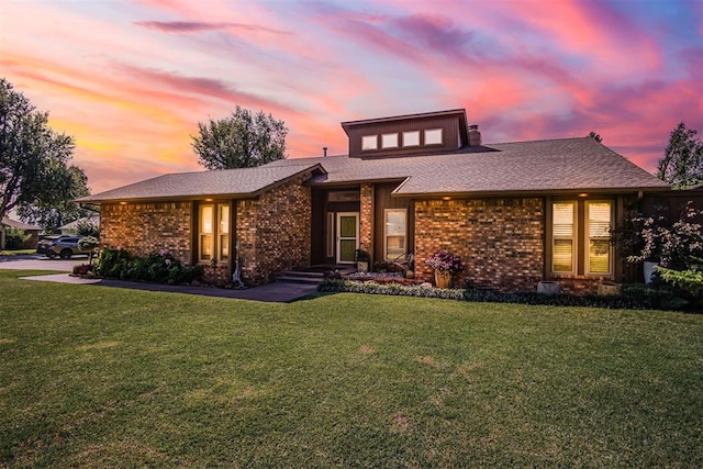 prairie-style house featuring a yard