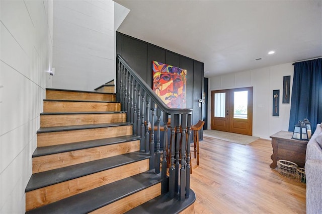 entryway with light hardwood / wood-style flooring