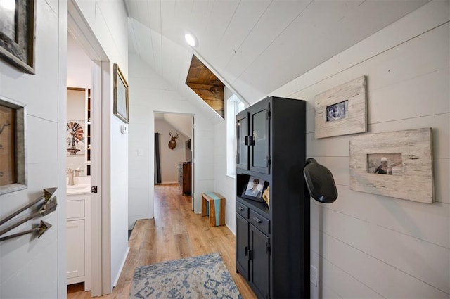 hallway featuring light hardwood / wood-style floors and sink