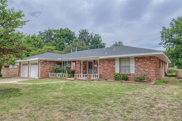 single story home with a garage and a front lawn