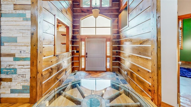 doorway featuring wood walls