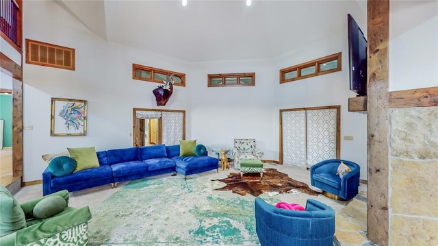 living room featuring a high ceiling