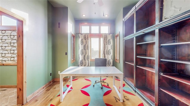 office area with ceiling fan and light wood-type flooring