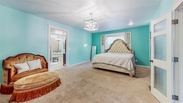 carpeted bedroom with an inviting chandelier and ensuite bath