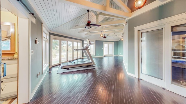 unfurnished sunroom with lofted ceiling with beams, wood ceiling, plenty of natural light, and ceiling fan