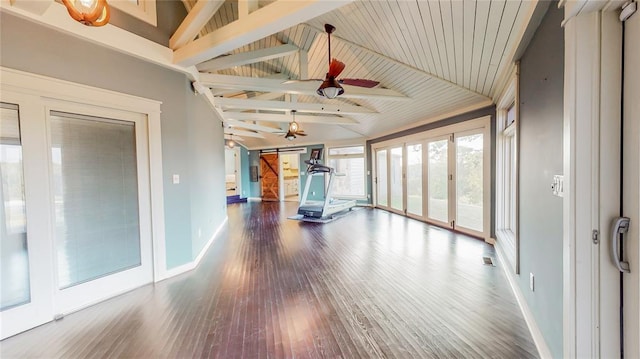 exercise room with hardwood / wood-style floors, vaulted ceiling, ceiling fan, a barn door, and wood ceiling