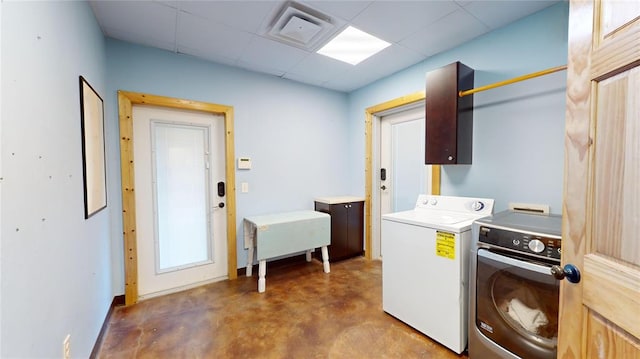 laundry room featuring washing machine and clothes dryer