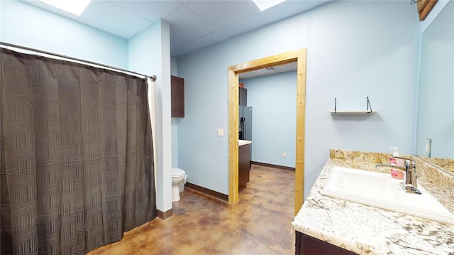 bathroom featuring vanity and toilet