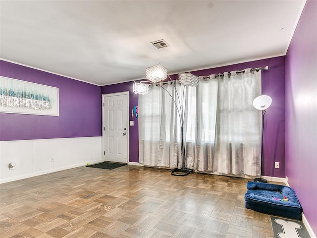 exercise area featuring parquet flooring