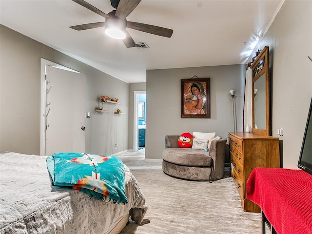 carpeted bedroom featuring ceiling fan and connected bathroom