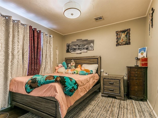 bedroom featuring crown molding