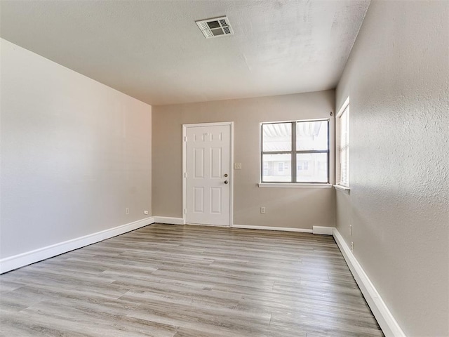 empty room with light wood-type flooring