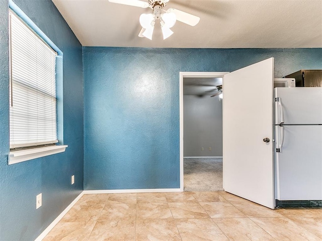 unfurnished room with ceiling fan