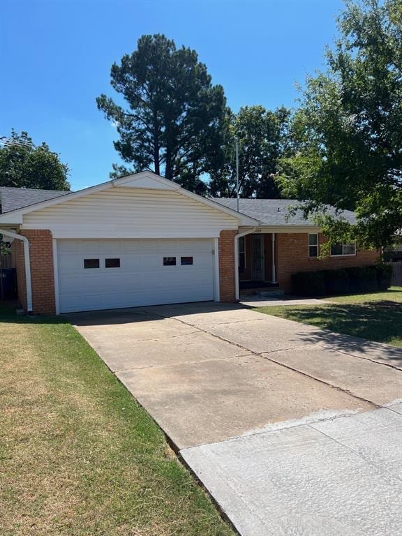 single story home with a front lawn and a garage