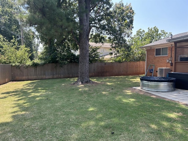 view of yard featuring central AC