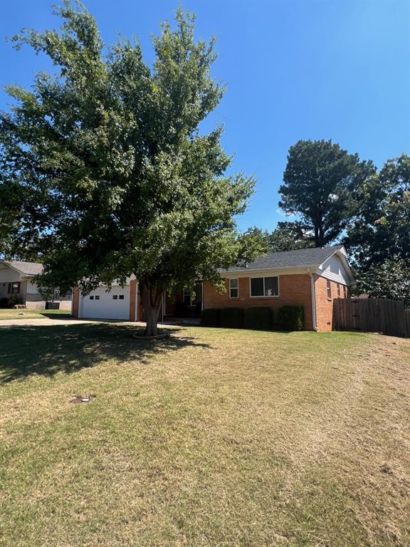 view of yard with a garage