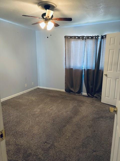 spare room with ceiling fan