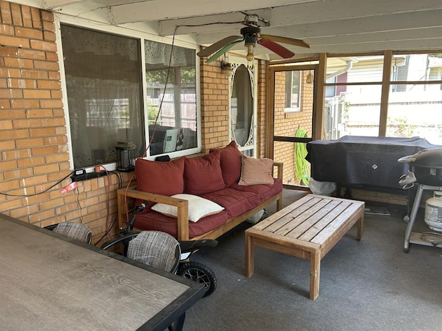 sunroom with ceiling fan and a wealth of natural light