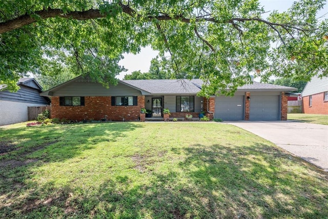 ranch-style home featuring a front yard and a garage