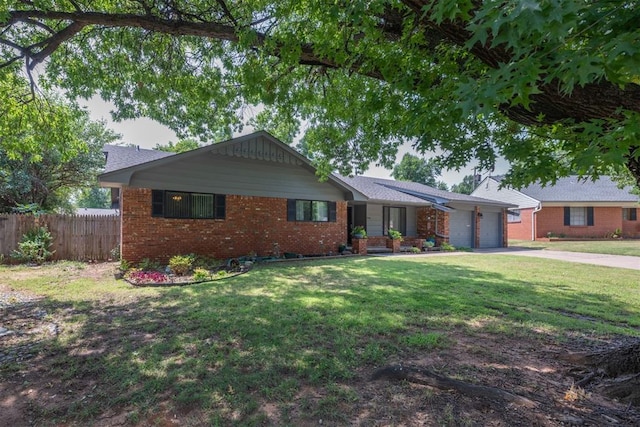 single story home featuring a front yard and a garage