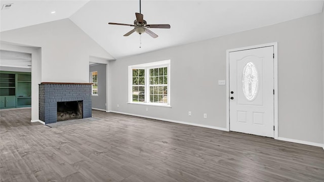 unfurnished living room with ceiling fan, hardwood / wood-style floors, high vaulted ceiling, and a brick fireplace