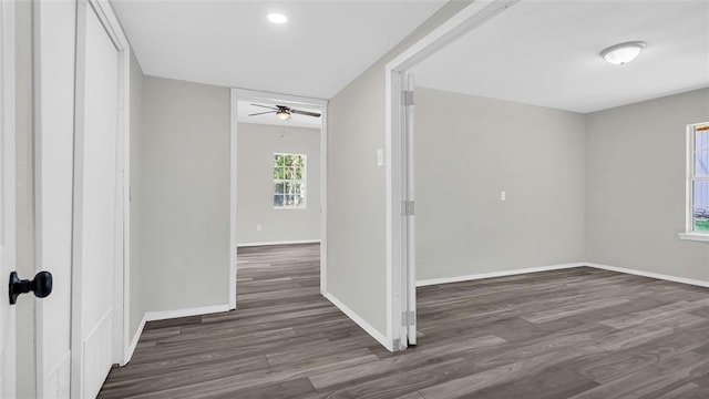 empty room featuring ceiling fan and dark hardwood / wood-style flooring