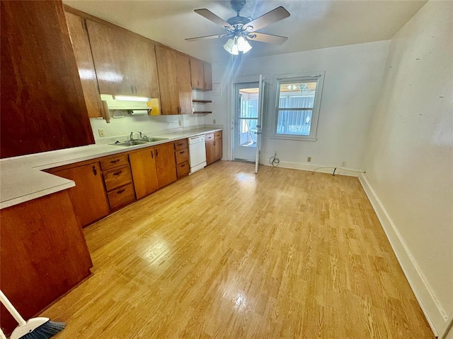 kitchen with dishwasher, light hardwood / wood-style flooring, ceiling fan, and sink