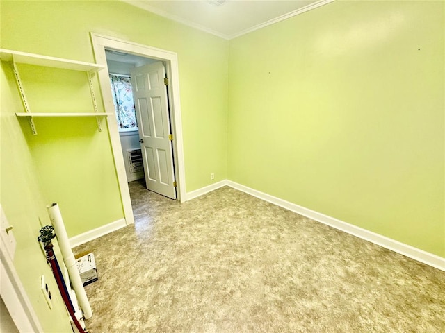 unfurnished room featuring carpet flooring and ornamental molding